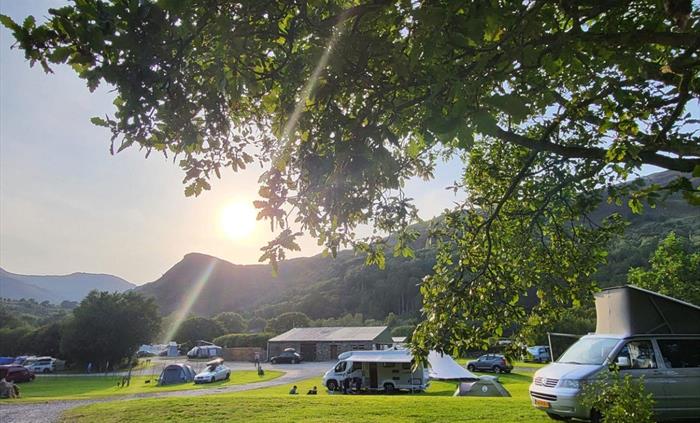 View of Cae Du campsite with motorhomes, campervans and tents